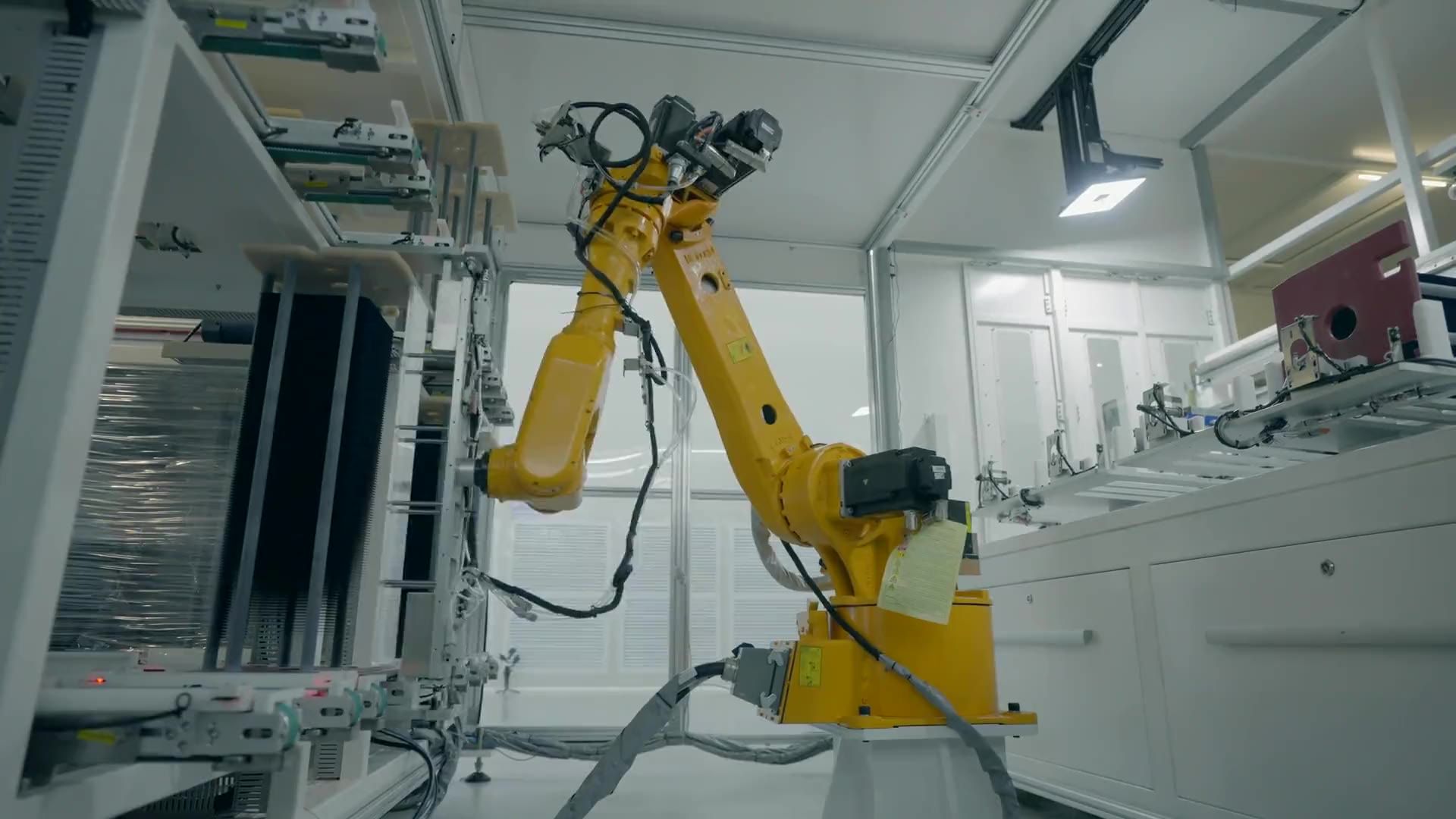 An industrial robot arm on a factory production line