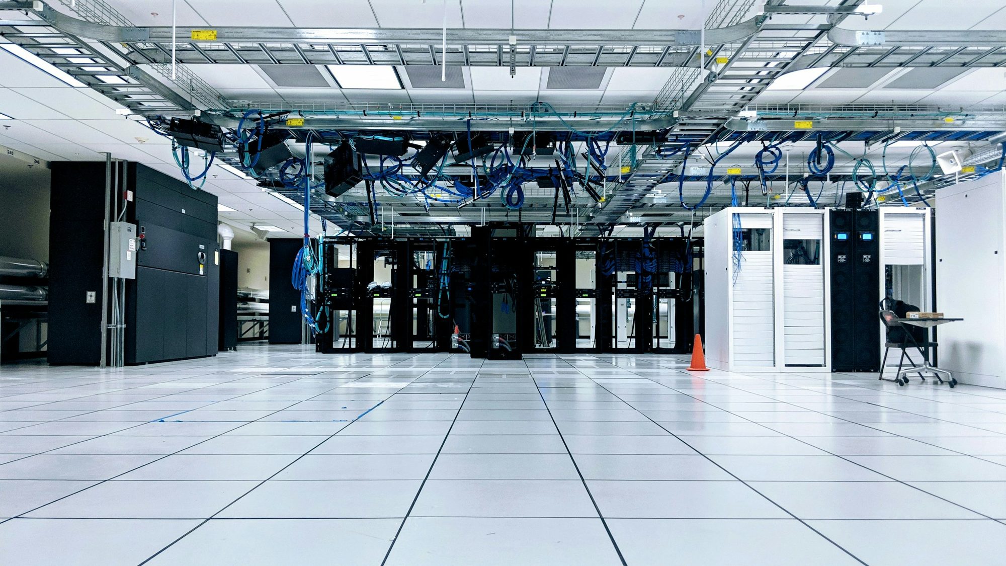 A data centre hall with rows of server cabinets